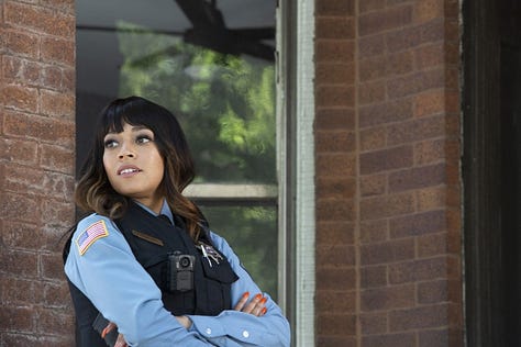 images of Chandra Russell as Sgt. Zenobia Turner in the show South Side, sporting a variety of wigs: long blonde hair, a wavy wig with a bang, a long brown wig swooped to the side plus mini top buns on each side, pink bob with a bang, a long curly half-up/half-down situation, a blonde auntie bowl cut, and another bob but make it grey-ombre.