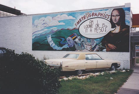 Pictures of murals on some walls in Calgary.