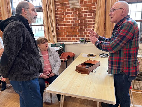 People at work fixing peoples’ broken home appliances at a weekend repair cafe
