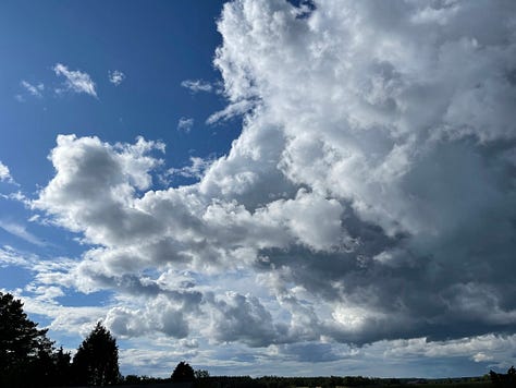 Three photos of fluffy white clouds hanging in the sky