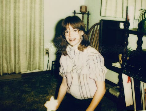 Hideous proof of the author's 7th grade fiasco: glasses, braces & headgear, some train wreck of a Halloween costume with home made Bermuda shorts, a feathered cape, and a bird beak. At least there was redemption of the cheer-nerd in orange, black and four eyes.