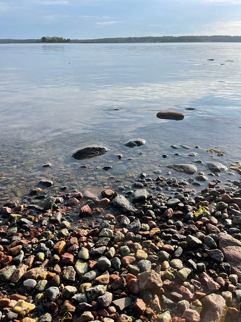 A lone rock in small cauldren, Åland; Lichen covered granite, close up on Åland; the water's edge all pebbles ans stones, Åland; A mountain of smooth stones, UK; wet, dark stones with one white quarz bit, Cornwall, UK; Piles of slate stone in St Nectan's Glen, Cornwall, UK