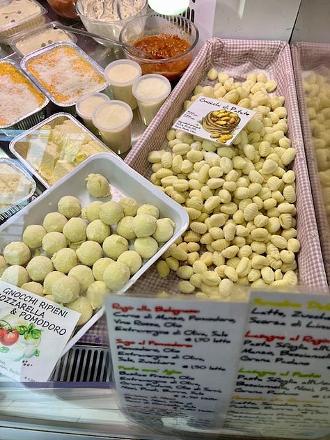 Top L-R: Ready to roast in season Romanesco and orange cauliflower, savory breakfast, belly-warming comfort food: homemade beef broth and rice, Brothers Bar in Como, giant skiiers and 2026 Olympics ad (!!) on the Regione Lombardia building in Milan, Colazione da Tiffany, somebody is very interested in Saturday pizza lunch, gnocchi at Pastificcio Braglia in Como, mesmerizing old-fashioned Ambrosoli candy wrappers