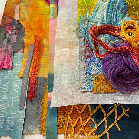 colourful fabric  and fabric scraps with bundles of threads on top