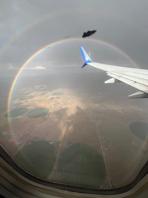 A full-circle double rainbow I saw flying home from California.