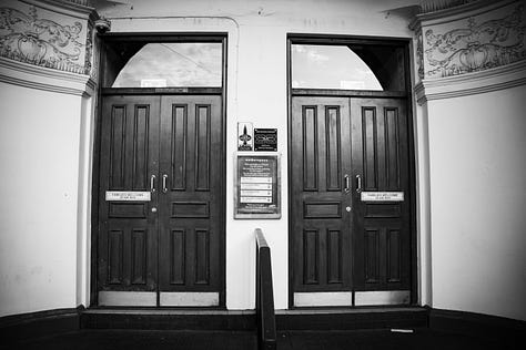 Black and white photographs of The foot of the Walk after it closed. The sign has been removed.