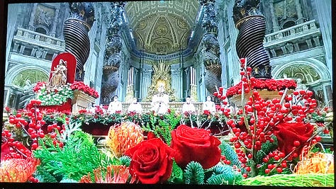 Images of the TV broadcast of Christmas Eve mass from the Vatican: The Pope, attendees, lesser clergy, sculptures, crazy architecture, opulence, vastness, ancient power.