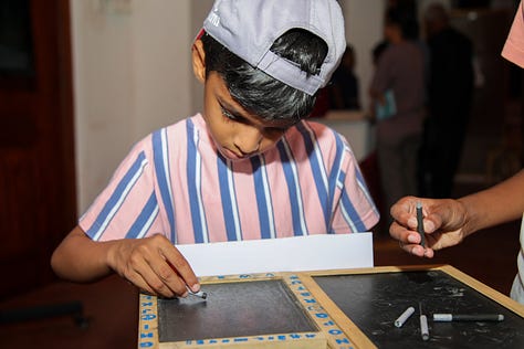 Children and Adults enjoying the Travelling History Museum's Exhibits 