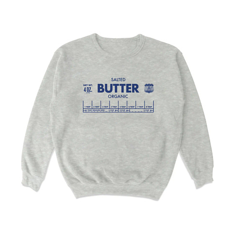 From left: A pickle menorah, olive charm hoop earrings, a grey sweatshirt that says butter.