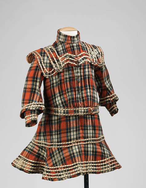 Wool Child's Dress from Russia. Tina H. Solomon gift to the Metropolitan Museum of Art. Jet buttons and wool plaid. Worn in 1905. 1890's style.