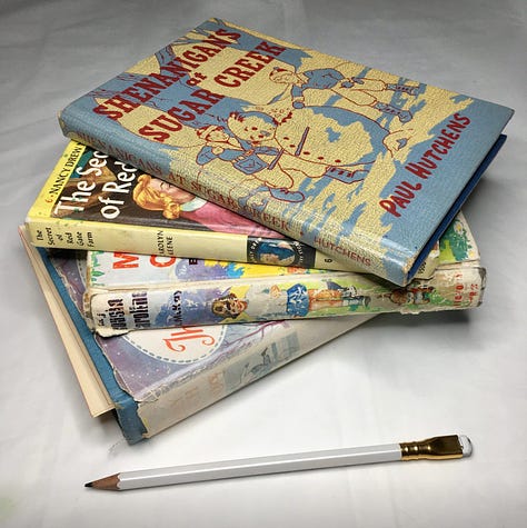 Some promotional images and photos of the vintage book art kits with white font information on a pale teal background and a sample photo from previous customers.