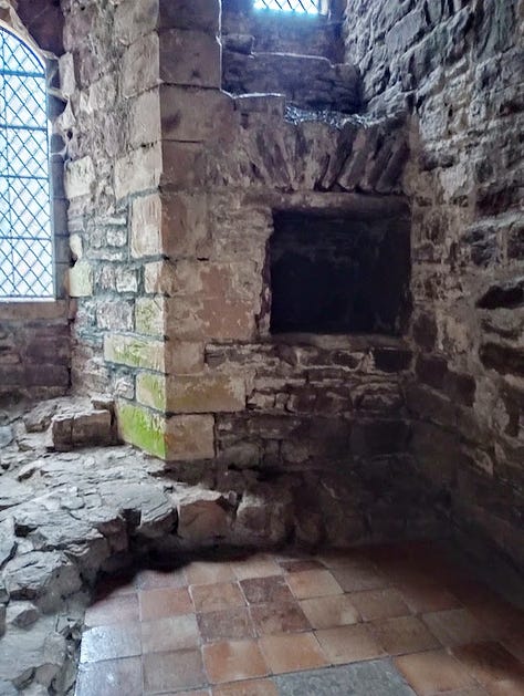 Photo of square open oven set in stone wall; Lines carved into stone wall from a distance, and close up