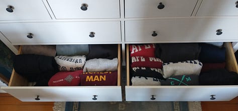 Shirs, hats, sweatshirts and yes, even underwear, arranged in color-coordinated rows in drawers and on hangers.