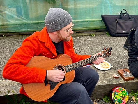 singing around the fire pit with various acoustic instruments, toasting marshmallows