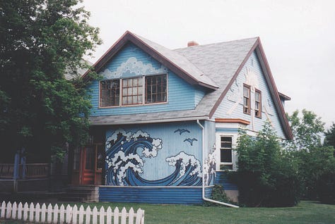 Pictures of murals on some walls in Calgary.