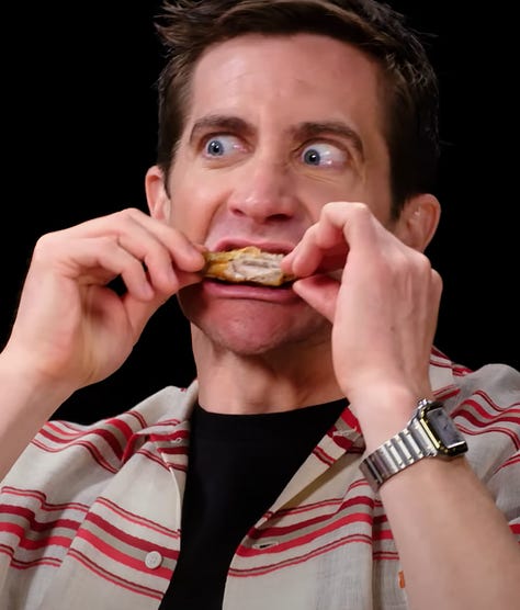 Pictures of Jake Gyllenhaal eating food or posing with food. 