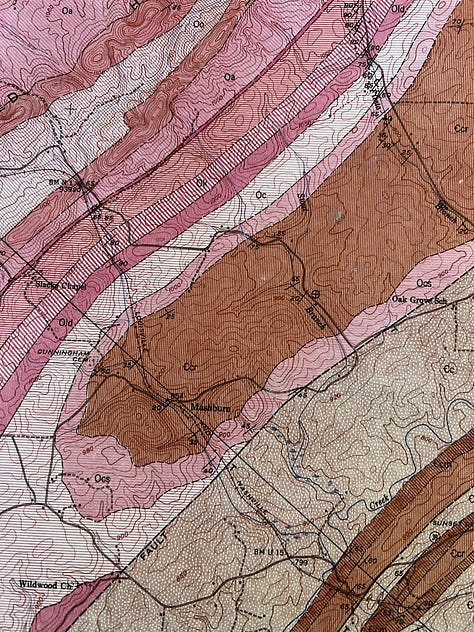 Five close-up pictures of topographic maps