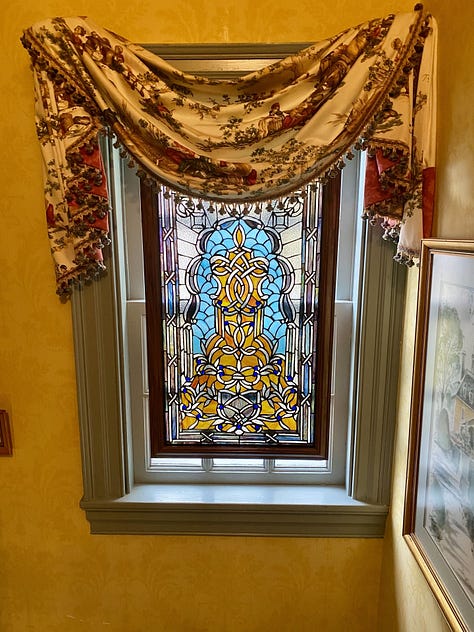 stained glass, breakfast quiche, comfy chairs, quaint bedrooms, nice seating area