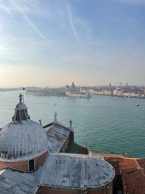 A beautiful mural in a grand hall; a view of Venice from a bell tower; a tiramisu