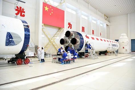 Hardware for the Long March 2D being prepared for integration at Jiuquan along with the rockets fairing heading to the launch pad.