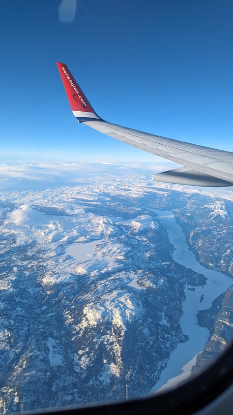 Three images: the white wing of the plane, tipped with red, high above a frozen river and mountains below. Also a silhouette of a plane window framing a vibrant, rainbow-stripe sunrise over white clouds. Last, a neon orange square of light cuts across a paragraph of Thin Places by Kerri Ni Dochertaigh.