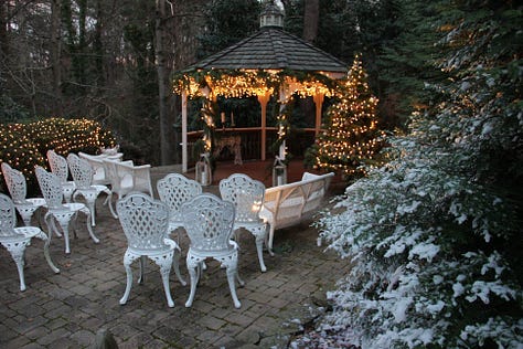 a wedding venue, seating near a fireplace, a cottage, a veranda, a bedroom