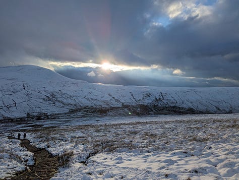 Sunset walk on Pen y Fan in winter with snow 