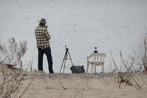 Photo of John Charlton waiting for clouds to clear by Ron Waddling