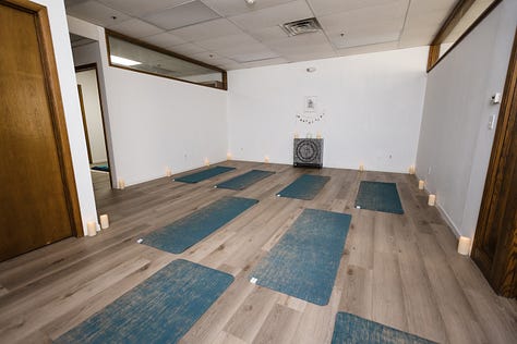 white blankets over blue chairs in waiting areas in a wellness studio