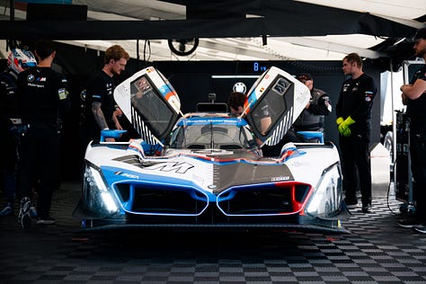 BMW M Team RLL crew members prep their cars and plan their attack ahead of the IMSA Monterey round at Laguna Seca in May 2025. Photos by Walter Fulbright.