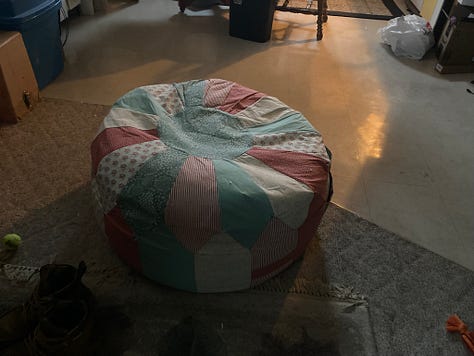 a series of six photos showing the progress of the 30 inch ottoman pouf including a shot of the thread wrapped around the bobbin holder of the sewing machine