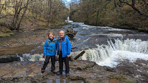 two hikers in the waterfalls area of the brecon beacons