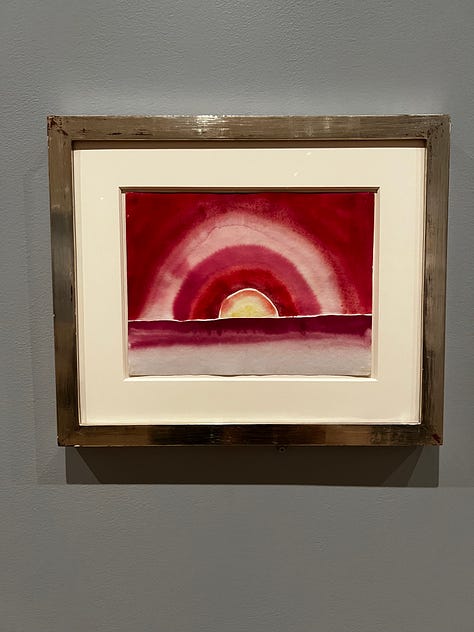 Images from the Georgia O'Keeffe show at the MoMA. Some are works on paper, mostly swirls; others are watercolors of nudes, sunrises, flowers, or rocks.