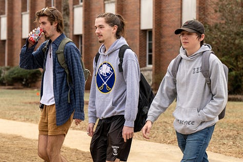 Students walk across the Troy campus heading to class