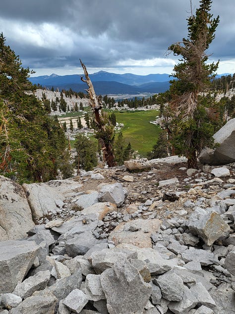 images of the granite and greenery of the majestic southern Sierra Nevada: Melanie and John at a bridge, PCT sign posts, mid-day nap,storm clouds coming, and atop Mt. Whitney at 14,505 feet