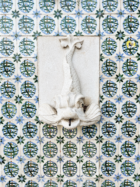 Photos of blue and white tiles, orange rooftops, and cathedral cloisters in Portugal, with a young white man and woman in frame