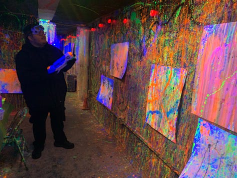 Undergraduates in my beginning fiction class create neon-paint masterpieces in Project Human X's Splatter Room