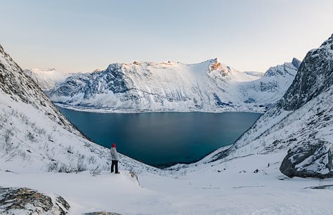 Showing the way up Husfjellet on Senja Island, Norway during a snow covered month of January. Snow capped mountains of Senja
