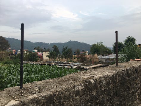 various cities, buildings, hills, lakes with boats, wild rivers, a stupa, the countryside, and the "view" of the Annapurna mountain range