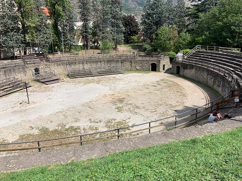 Gladiator Fights in Susa. Little towns in Italy often contain unexpected treasures. They preserve the antique artifacts better than the famous tourist attractions. I want to show you the amphitheater of Susa today. 