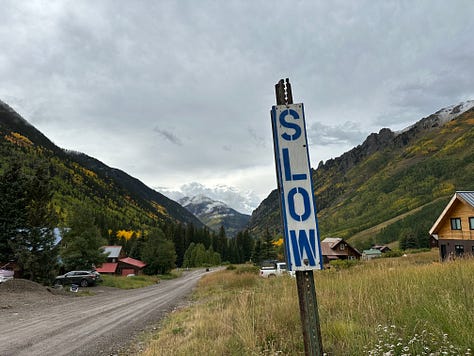 various handmade signs telling you to slow down