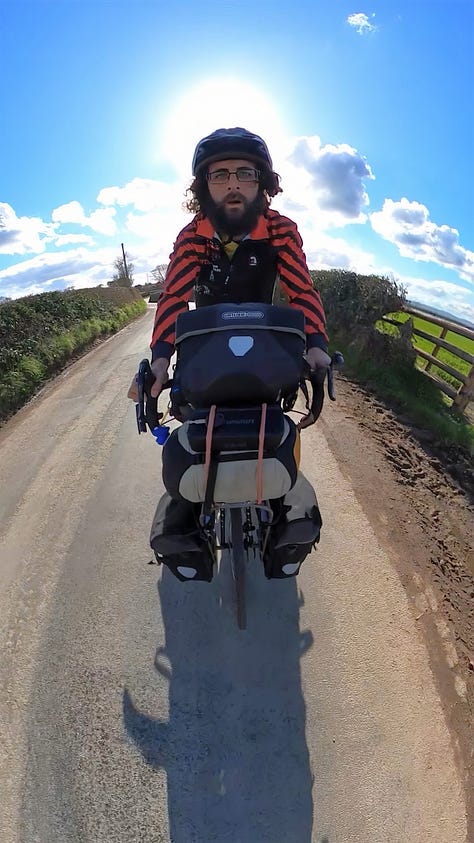 Ghandi cycling his bike through the Shropshire countryside during a beautiful sunny spring day.