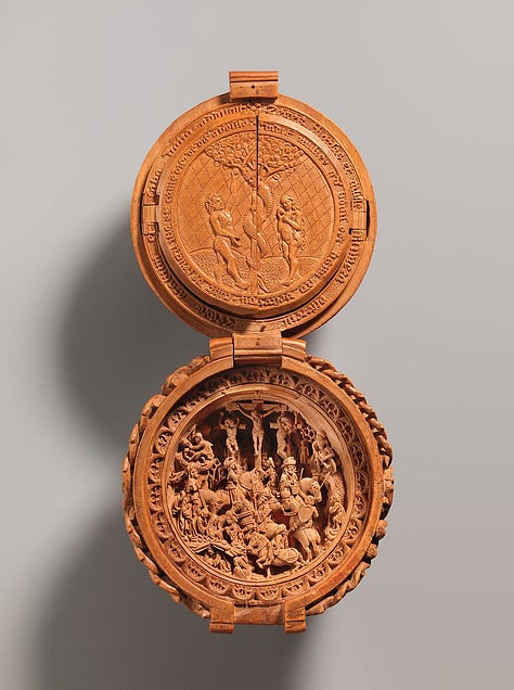 Intricately carved wooden sphere which opens to reveal scenes from the life of Jesus.