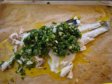 Left: sheet trays of roasted asparagus and onions and one of whole branzino.  Center: a branzino filet topped with salsa verde.  Right: salad topped with shredded mozzarella.