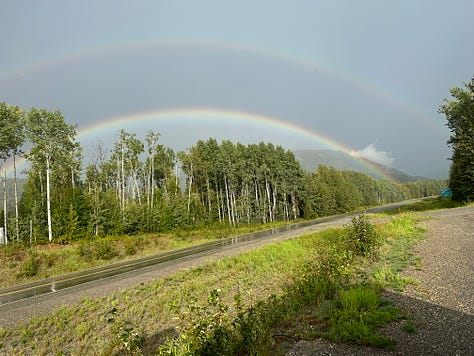 Images of a Smoky orange sunset, epic downpour, and a double rainbow