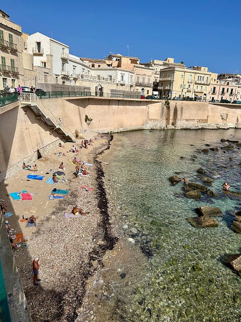 People swimming and lounging at the Solarium Forte Vigliena: Gillian Knows Best guide to Ortigia