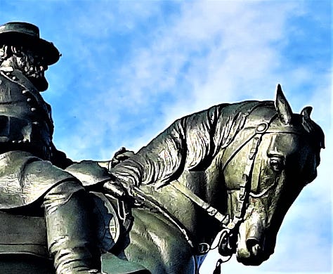 Equestrian statue of General Howard at Gettysburg from far away and close up.