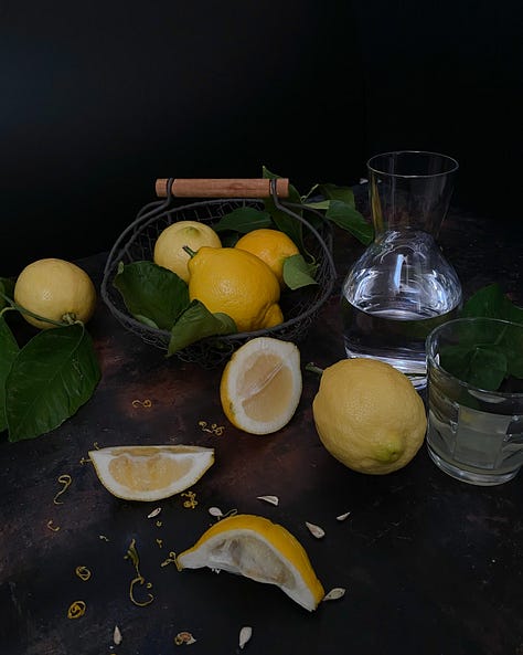 Three still lifes with lemons, whole and quartered, sunlit in southern France