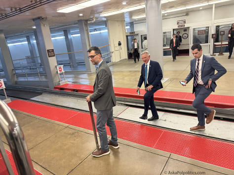 Sen. Tommy Tuberville catches Senate tram.