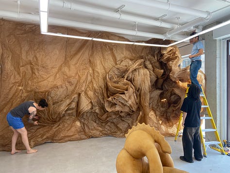 large wall or floor based sculptural installation made of waxed kraft paper which allows sunlight to penetrate it, warming the viewer